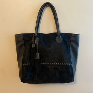 Real Italian Leather and faux cow hide tote. Black with tassel accents. Large